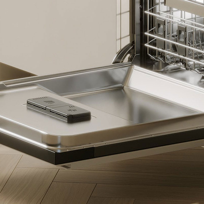 Close-up van V-ZUG vaatwasser met doseercompartiment op de deur, compatibel met All-in-1 vaatwastabs en andere tabletten.