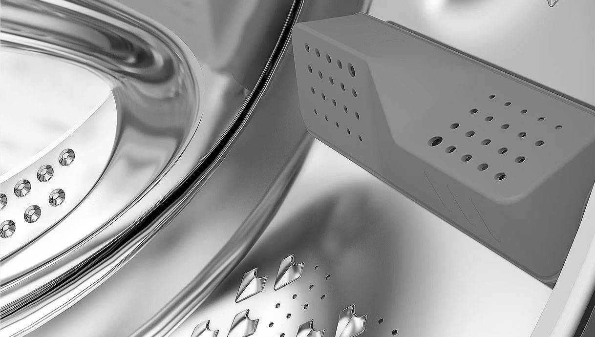 Detail van Beko AquaWave trommel met gebogen deurruit en trommelschoepen voor zachte, gelijkmatige wasbeweging