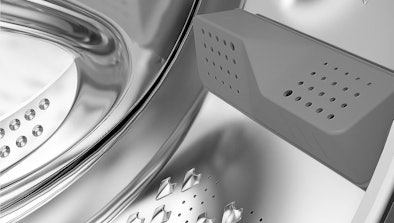 Detail van Beko AquaWave trommel met gebogen deurruit en trommelschoepen voor zachte, gelijkmatige wasbeweging