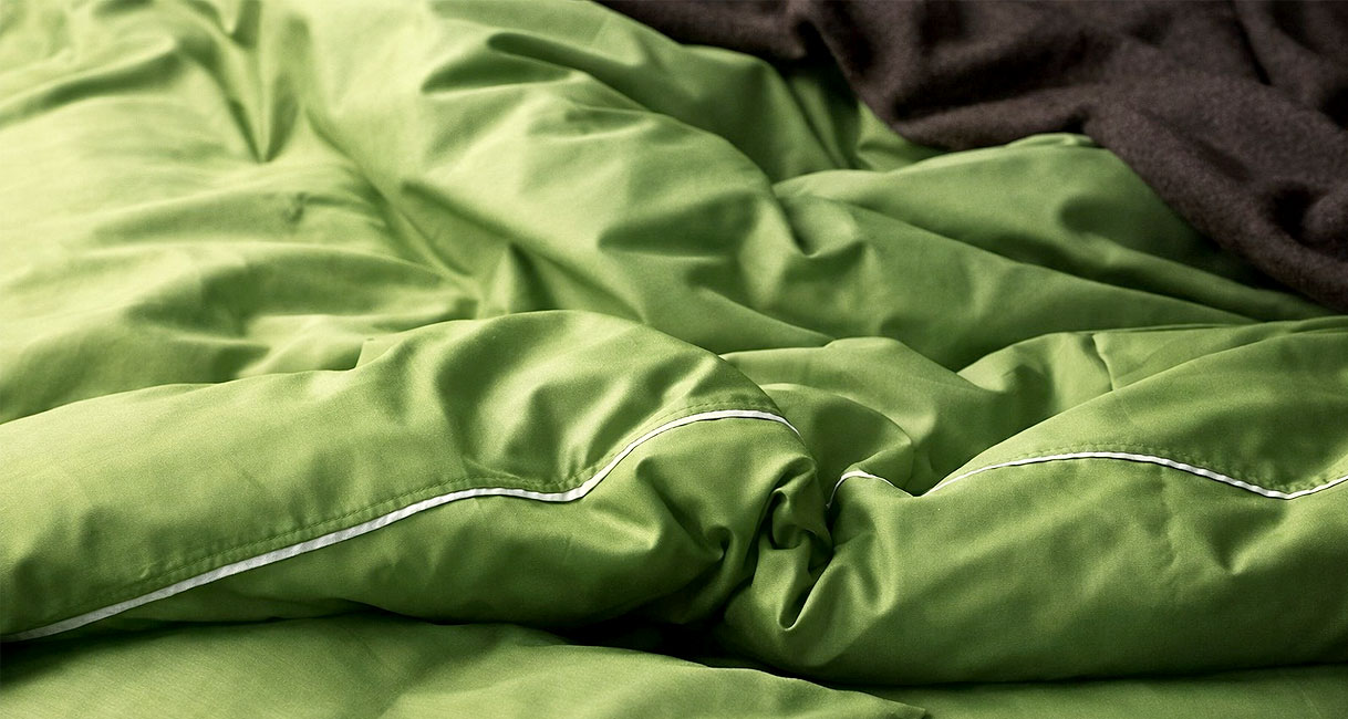 Groen dekbed en beddengoed geschikt voor intensief wassen en extra spoelen