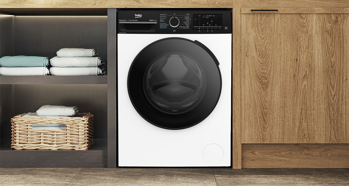 Beko 10 kg wasmachine met grote trommel en ProSmart Inverter-motor in moderne wasruimte.