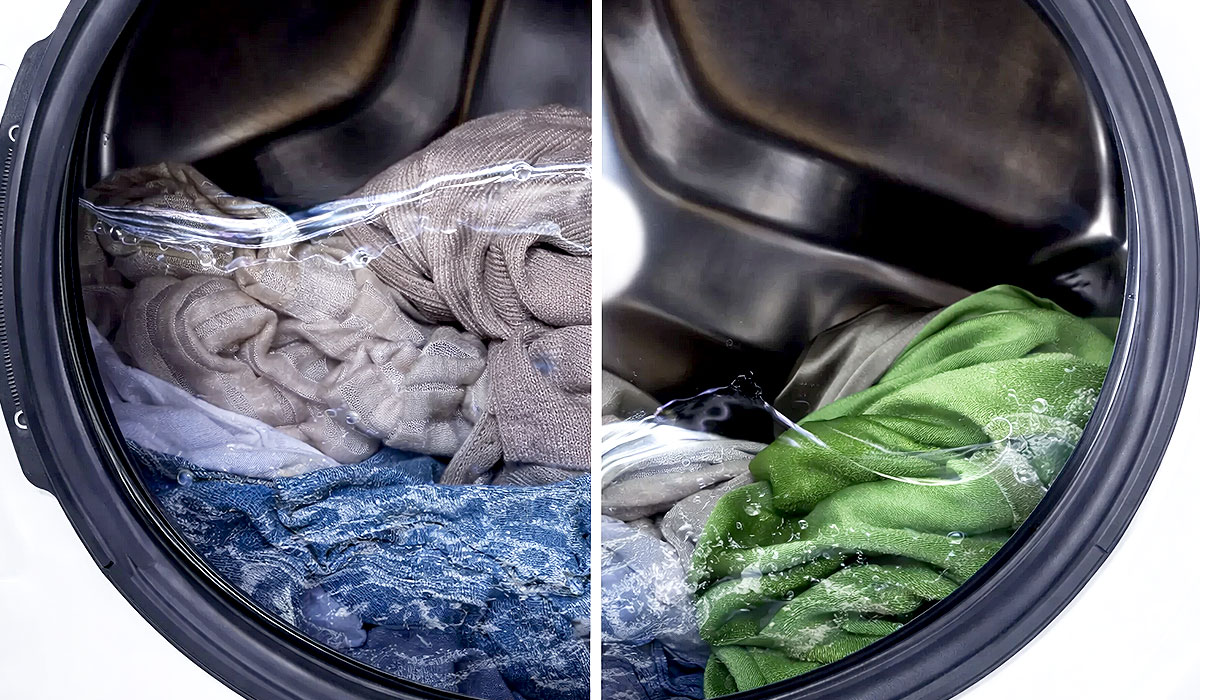 Wasmachinetrommel met wasgoed en adaptieve waterverdeling