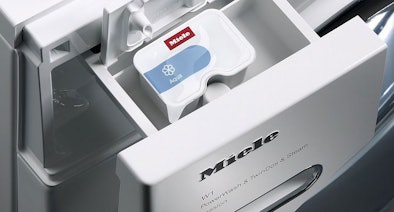 Miele CapDosing systeem met wasmiddelcapsule voor automatische dosering bij speciale textielsoorten
