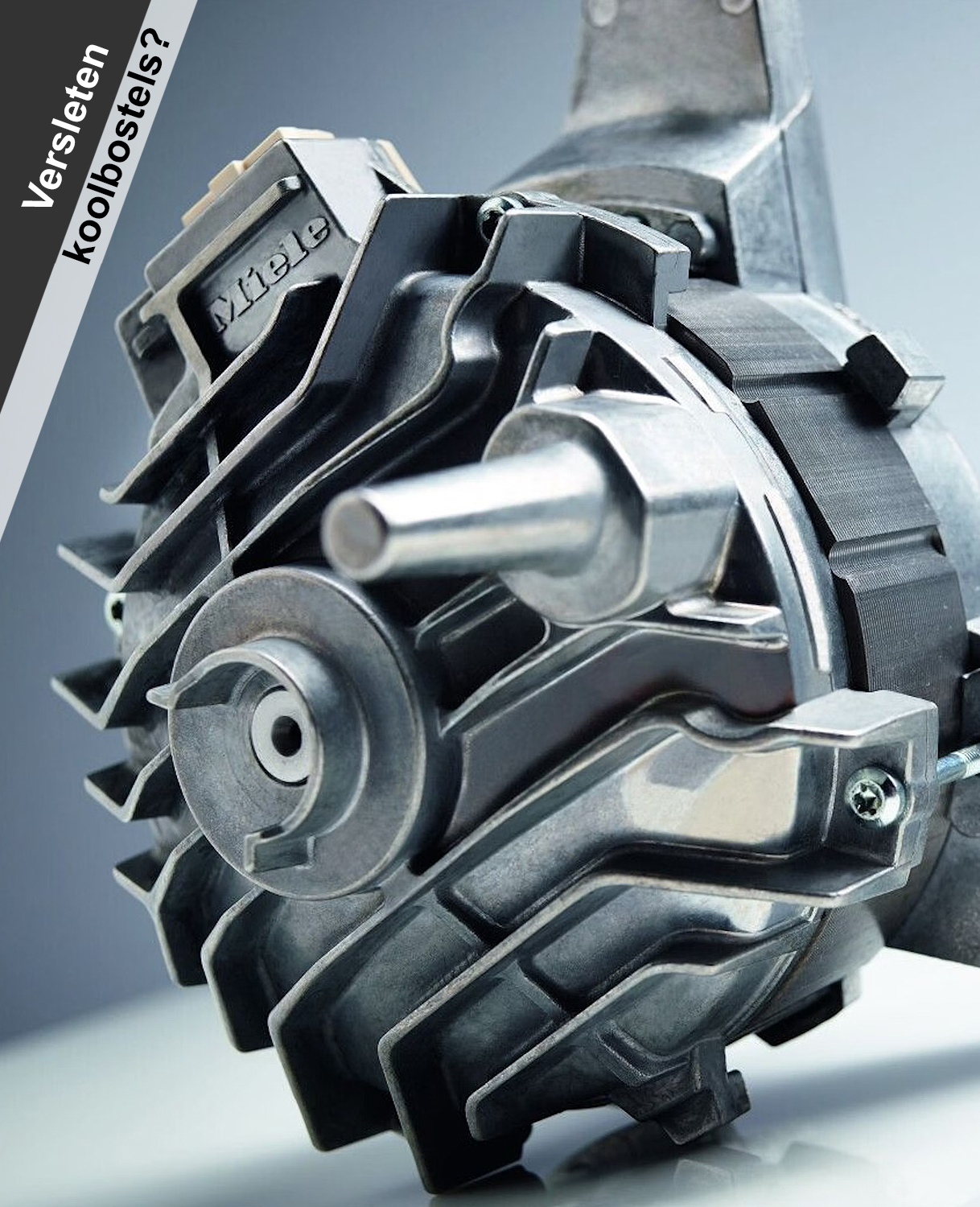 Close-up van een Miele wasmachinemotor met zichtbare as en motorbehuizing