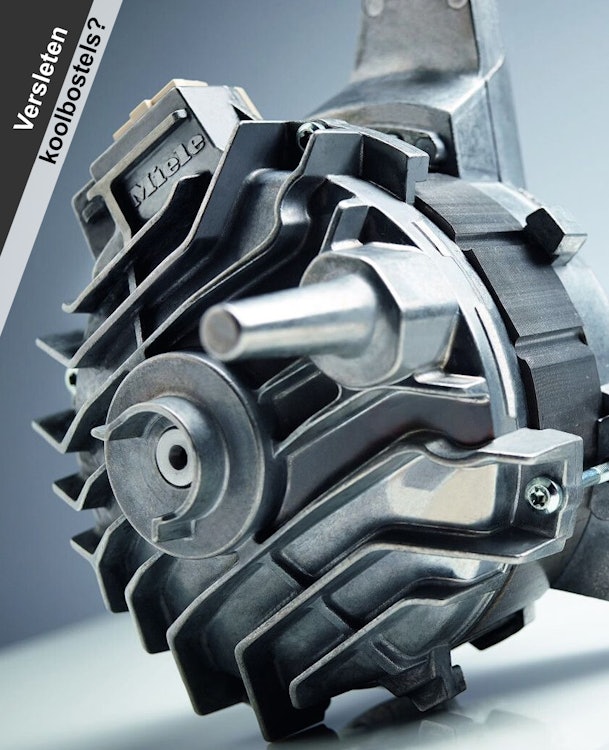 Close-up van een Miele wasmachinemotor met zichtbare as en motorbehuizing