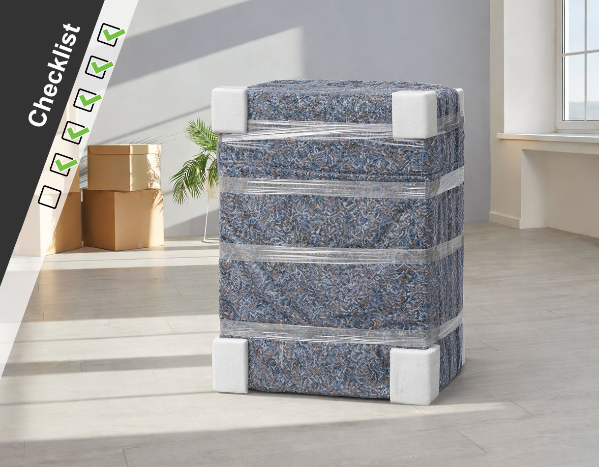 Volledig ingepakte wasmachine met verhuisdeken, hoekbeschermers en krimpfolie, klaar voor transport