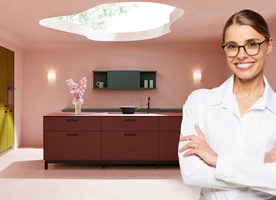 Design keuken in bordeauxrood met donker werkblad en olijfgroene hoge kasten van next125