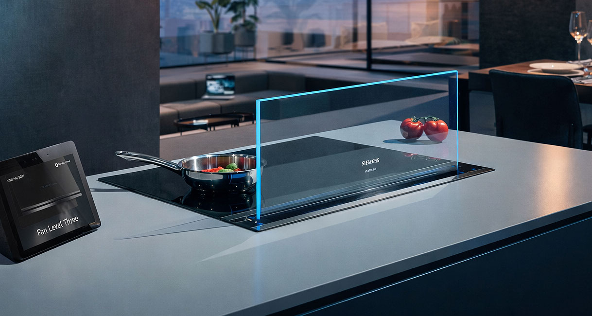 Downdraft afzuiging uitgeschoven naast inductiekookplaat in modern kookeiland