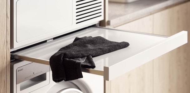 Droger op de wasmachine plaatsen.