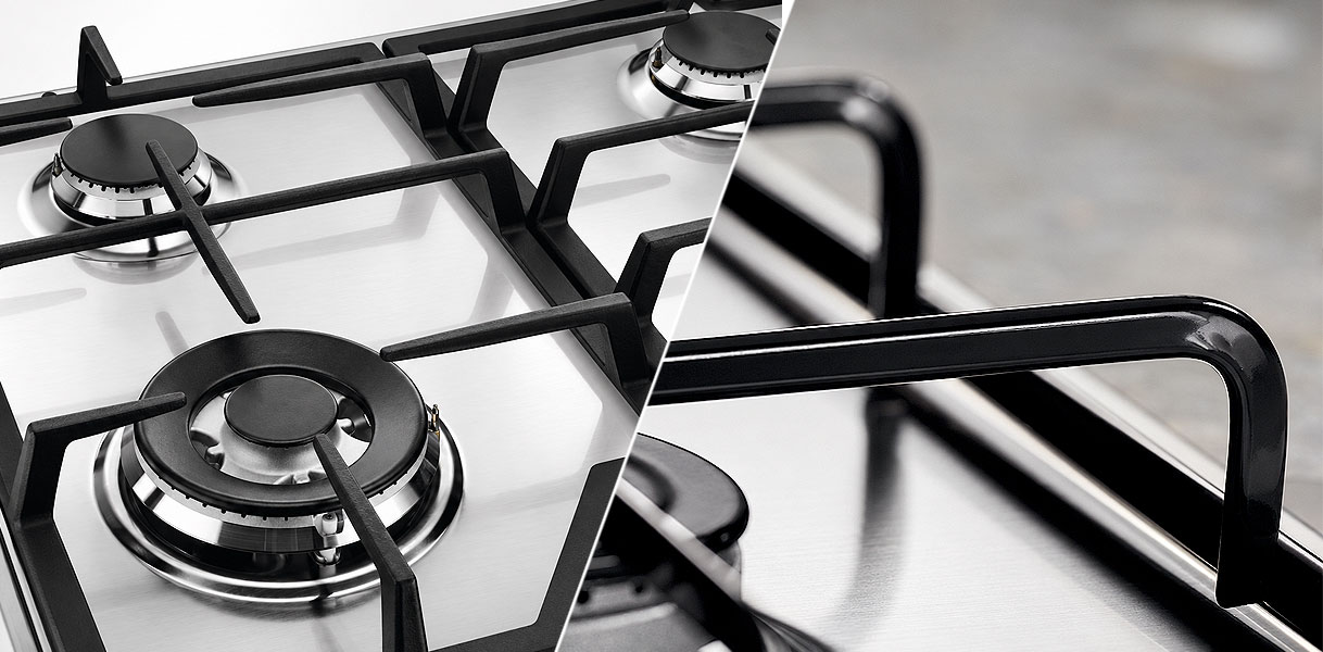 Close up van losse pannendragers per brander naast doorlopende gietijzeren dragers op een gasplaat