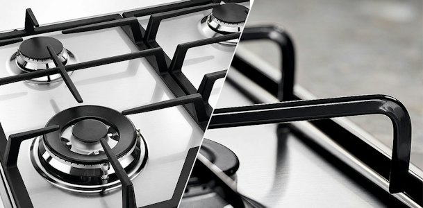 Close up van losse pannendragers per brander naast doorlopende gietijzeren dragers op een gasplaat