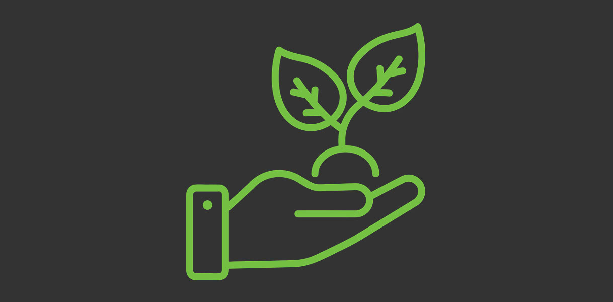 Icoon van een hand met plantje als symbool voor het energieverbruik van inductie