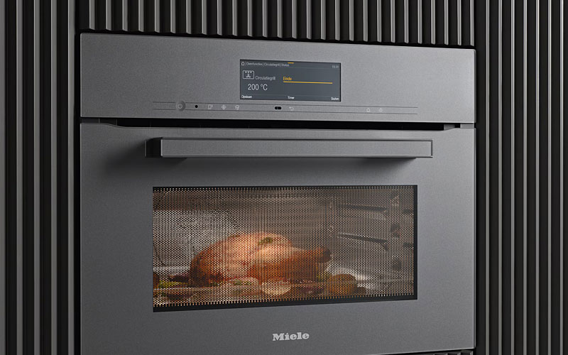 Miele combimagnetron met koel front technologie voor veilige bediening en koele ovendeur