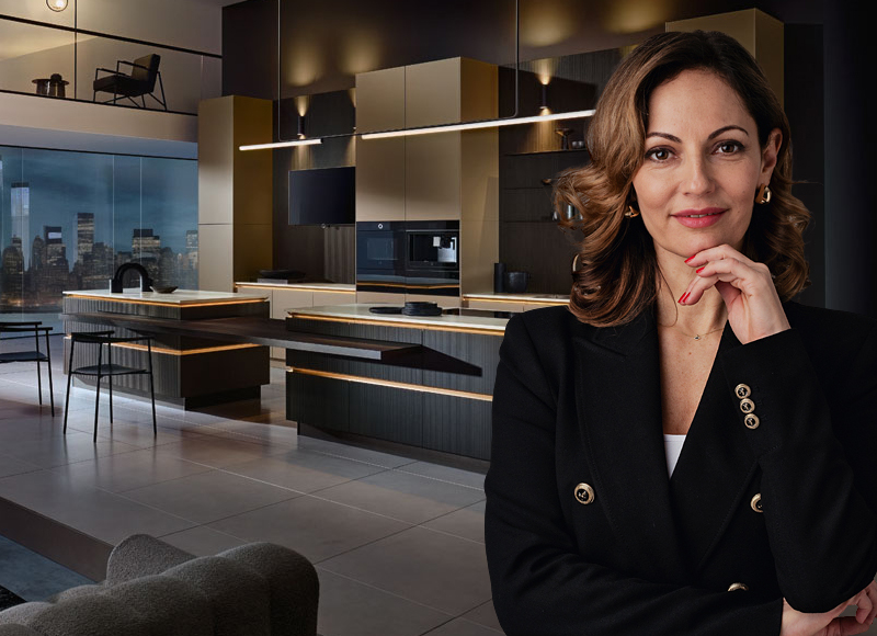 Luxe keuken van Bemmel & Kroon in donkere tinten met goudkleurige accenten en uitzicht op de skyline