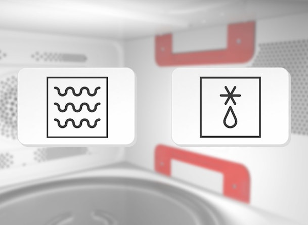 Magnetron symbool voor opwarmen drie golvende lijnen en ontdooien symbool met ijskristal en druppel naast elkaar