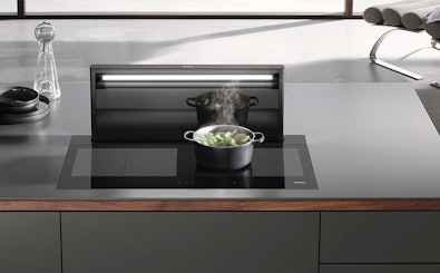 Miele downdraft afzuigsysteem geïntegreerd in kookeiland werkblad