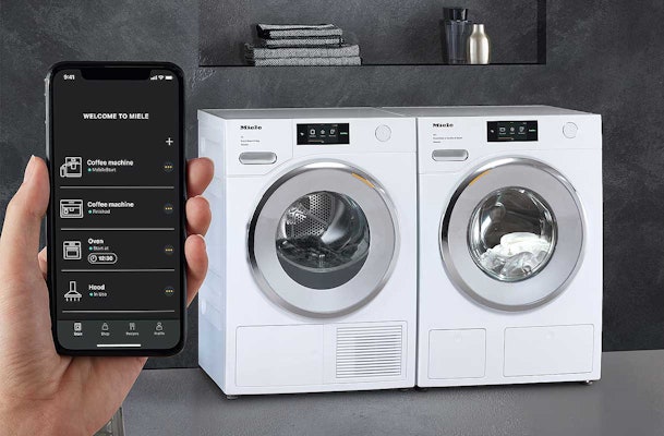 Miele@home app met witte Miele wasmachine en droger set
