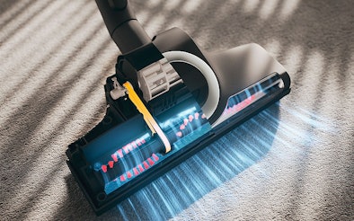 Stofzuiger mondstuk met LED-verlichting en roterende borstel toont optimale luchtstroom op tapijt