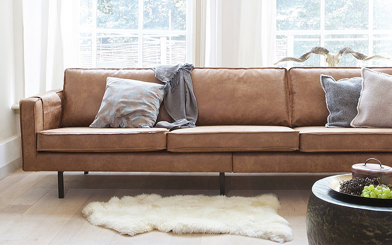 Leren bank houten vloer allergie-vriendelijke materialen minder stofophoping huisstofmijten