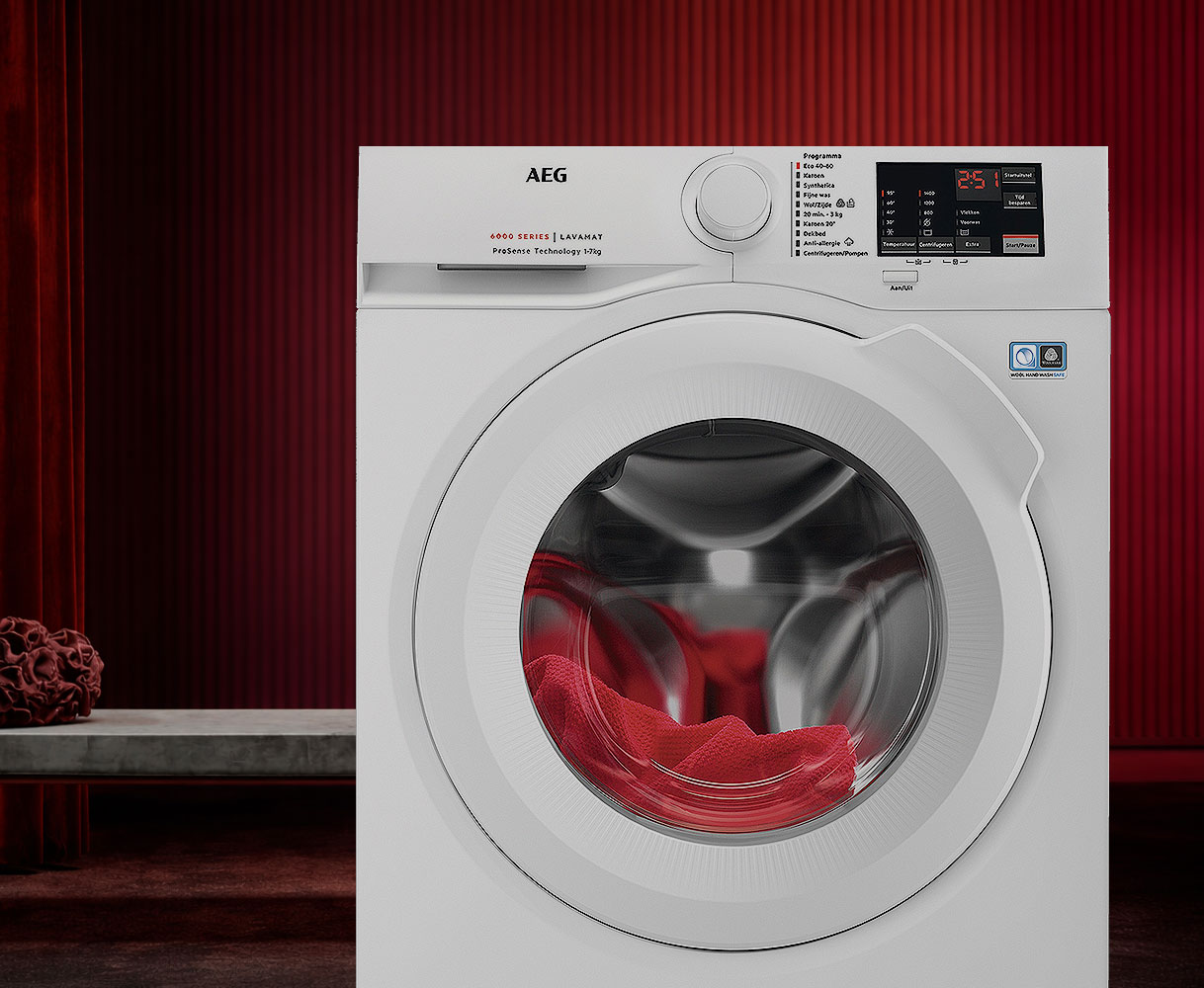 AEG Lavamat wasmachine met rood wasgoed zichtbaar in de trommel