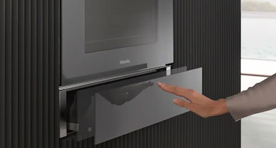 Miele warmhoudlade push-pull opening mechanisme greeploze bediening moderne keuken inbouw