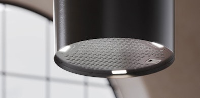 Ronde afzuigkap als vrijhangend cilindermodel met verlichting boven een kookeiland