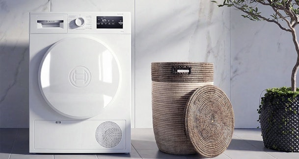 Bosch warmtepompdroger Serie 4 in een moderne wasruimte, betrouwbare instapper met AutoDry voor kleinere huishoudens