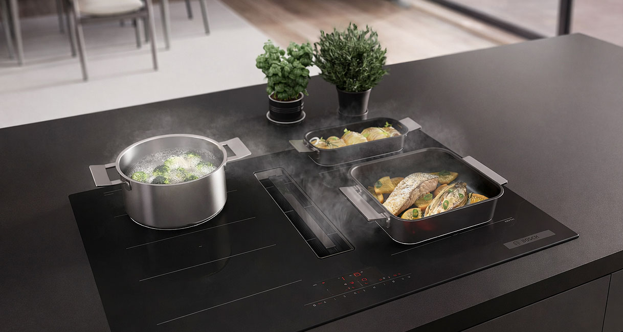 Bosch Serie 6 inductiekookplaat met afzuiging, CombiZone en meerdere pannen op het kookoppervlak