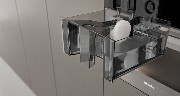 Uitneembaar waterreservoir van een stoomoven met ontkalkingstablet voor het automatische ontkalkprogramma
