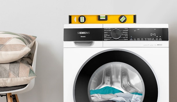 Wasmachine staat niet waterpas