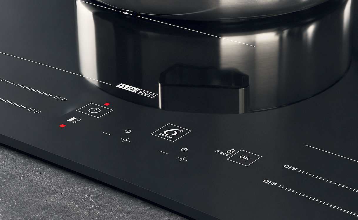 Bedieningspaneel met 6th Sense symbool op een Whirlpool inductie kookplaat