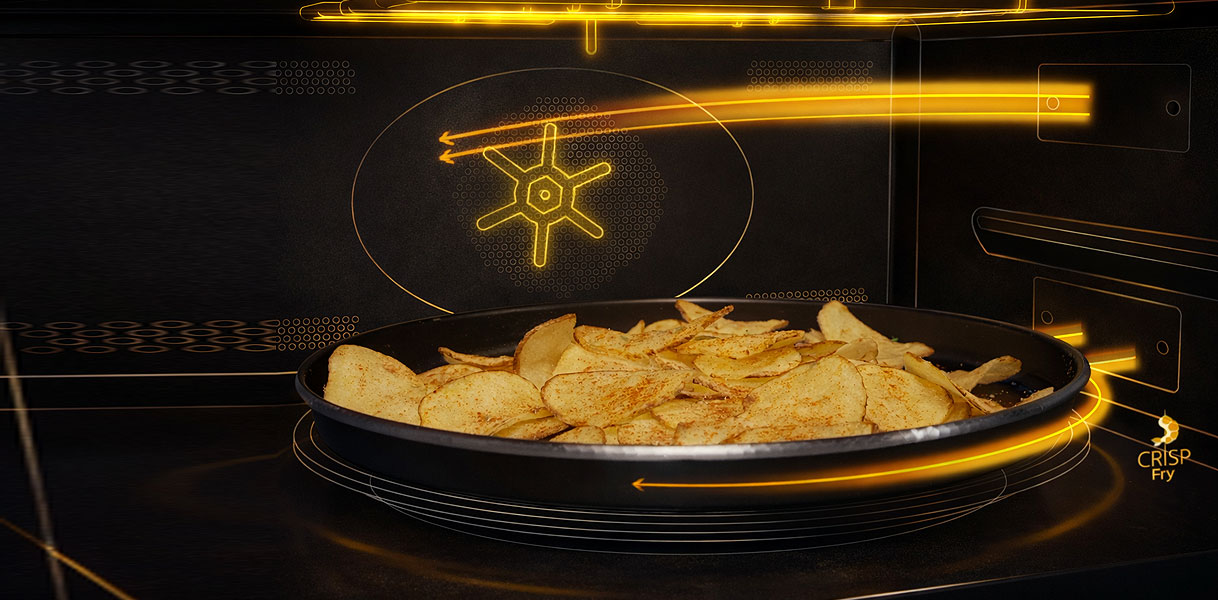 Whirlpool zwarte magnetron met CrispFry technologie voor krokante chips zonder olie op draaiplateau